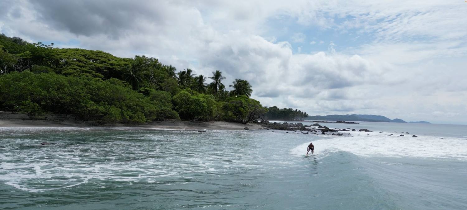 Surfing at Playa Cedros, the village's closest beach